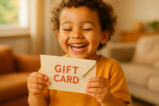 image of a child receiving a gift card envelope, child being happy
